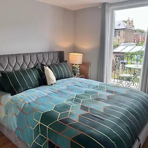 With Balcony Overlooking A Garden London