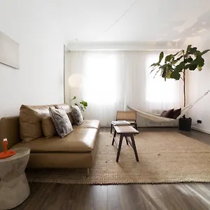 Tranquil Oasis W 100inch Cinema & Hammock, By The Design Traveller